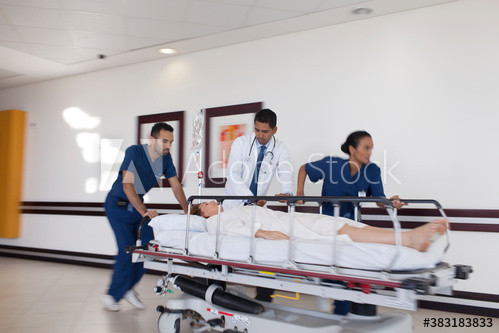 Free: Doctor and nurses rushing patient on stretcher in hospital ...